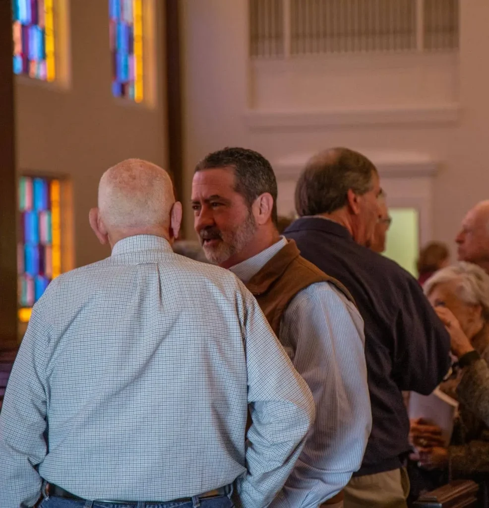 Church members connecting in small groups at Coggin Church for Bible study and community