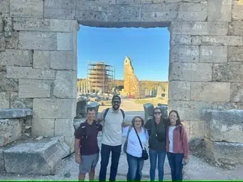Mission team members standing at a historic site during a cultural visit on a Coggin Church mission trip