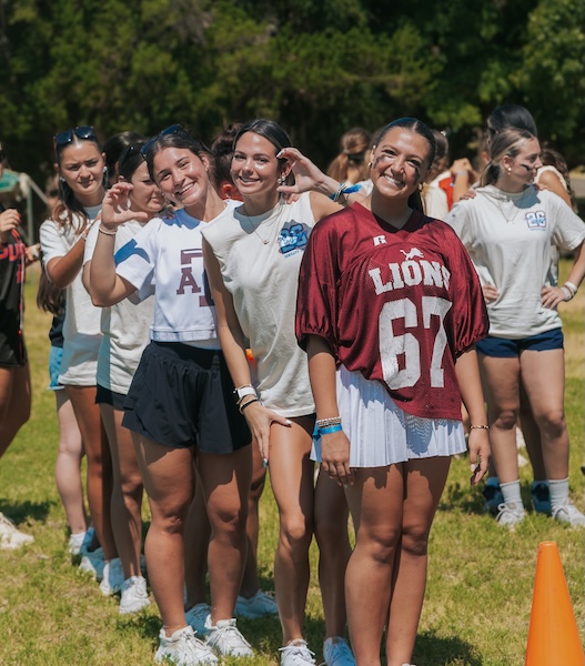 Coggin Youth students enjoying fellowship during an outdoor youth activity